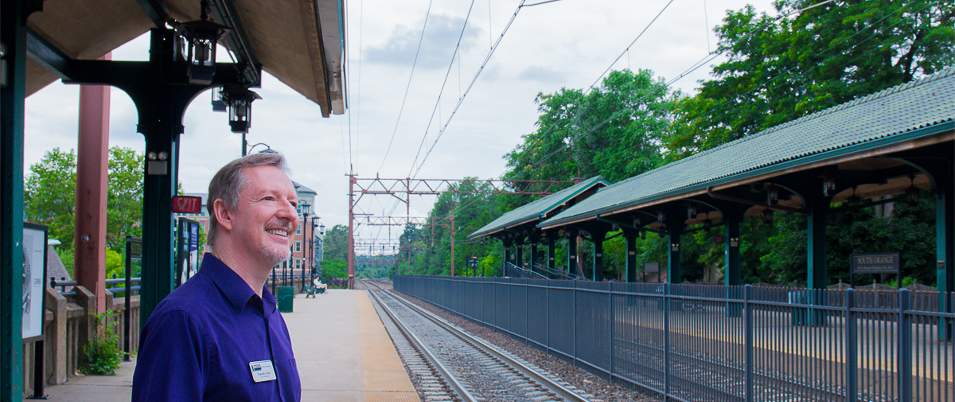 Tim Tyler standing on the train platform at South Orange station